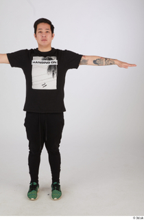 Photos of Miyasaki Kazuki standing t poses tatoo whole body…